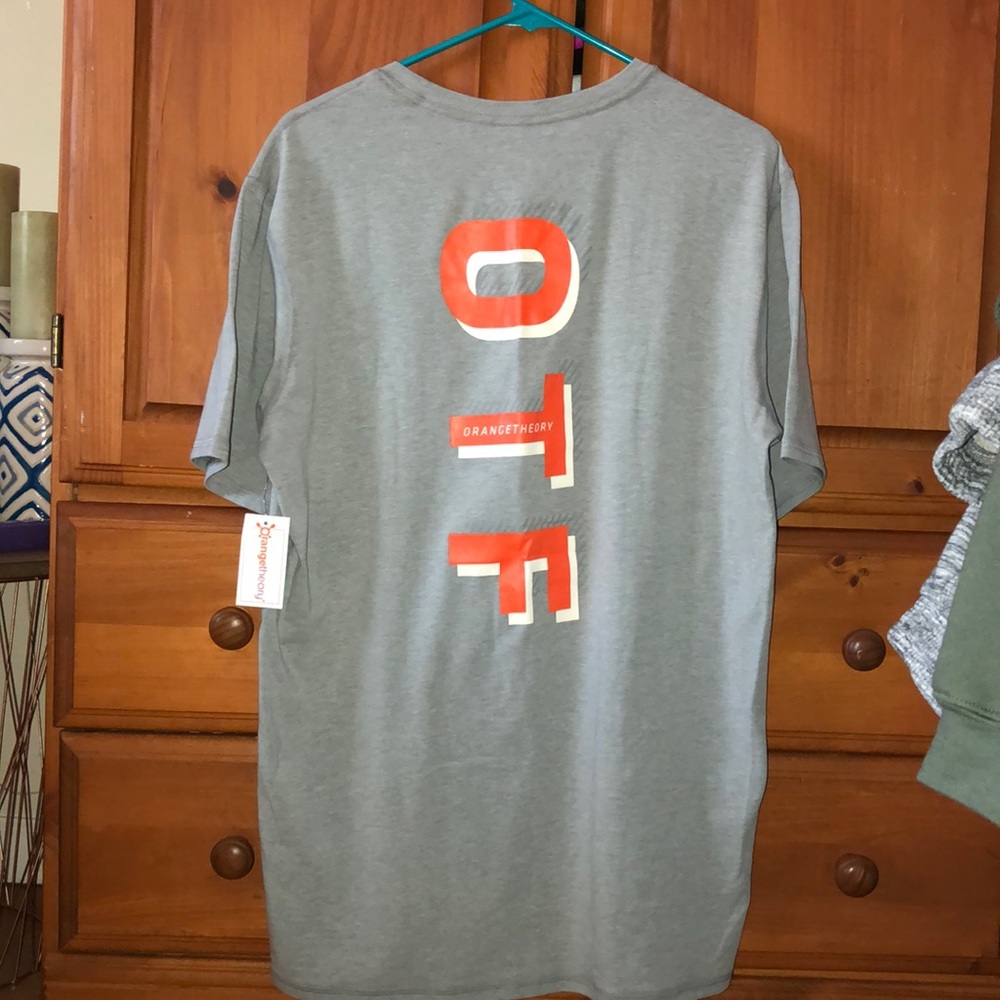 Brand new. Orange Theory T-shirt